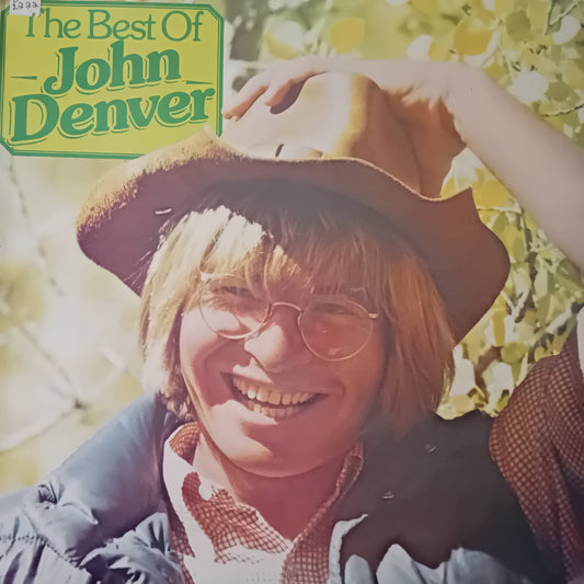 Album cover of 'The Best Of John Denver' with a person wearing a hat and sunglasses.