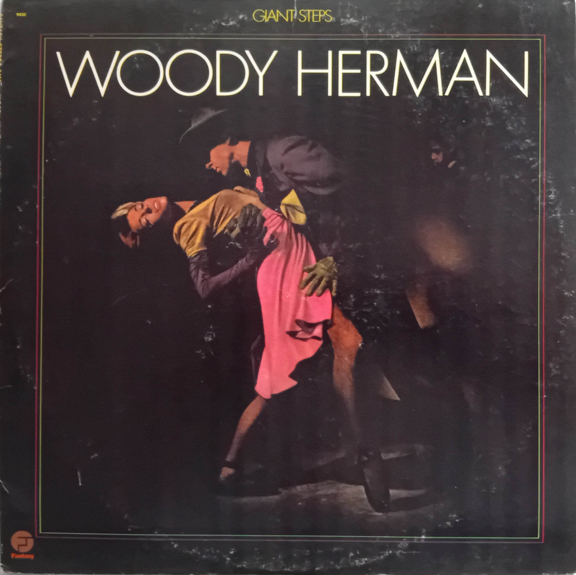Woody Herman 'Giant Steps' album cover, featuring a dark-toned photograph of a couple dancing tango with the title in large white letters at the top.