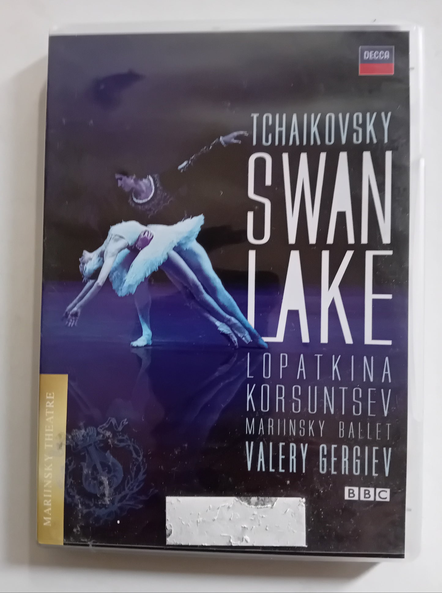 A boxed music release for Tchaikovsky's Swan Lake, showing a ballet dancer in a white tutu on a dark stage background. Visible text includes Tchaikovsky, Swan Lake, Lopatkina, Korsuntsev, Mariinsky Ballet, Valery Gergiev, Decca, and BBC.