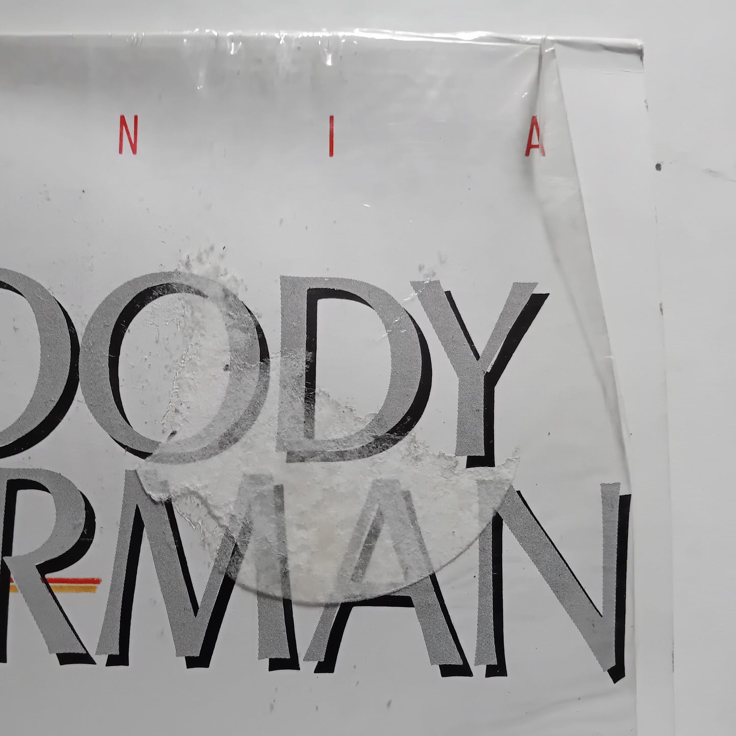 Album cover corner with  text on a white background