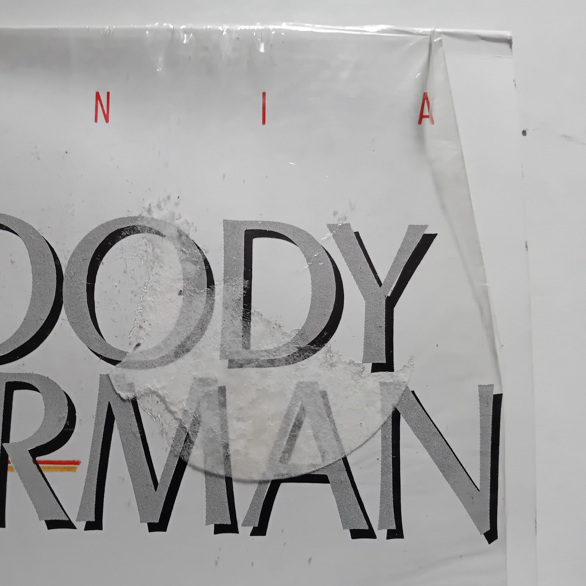 Album cover corner with  text on a white background
