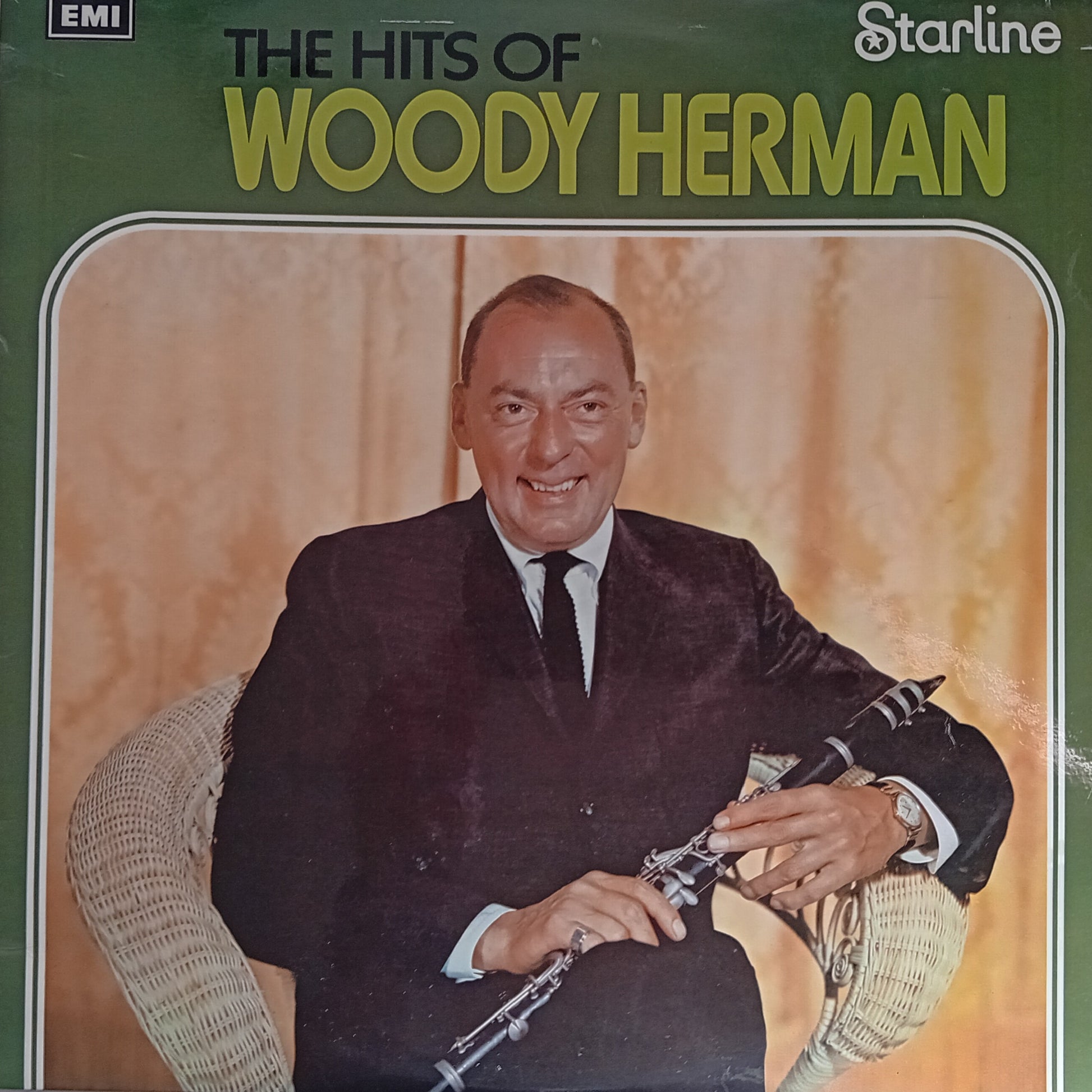Album cover of 'The Hits of Woody Herman' featuring a man holding a saxophone.