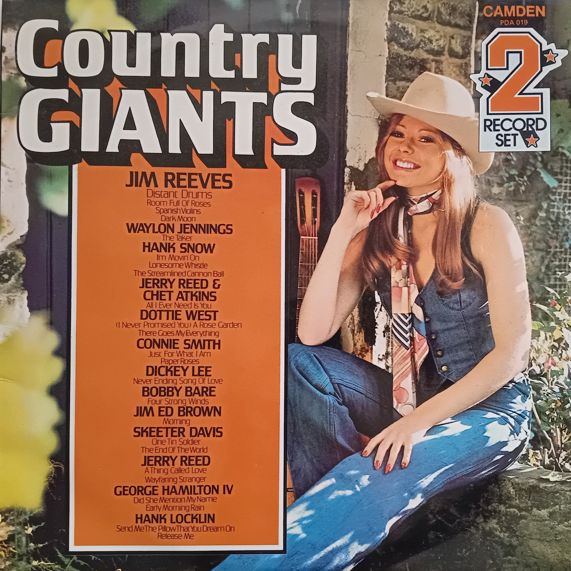 Album cover for 'Country Giants' featuring a woman in a cowboy hat and vest.