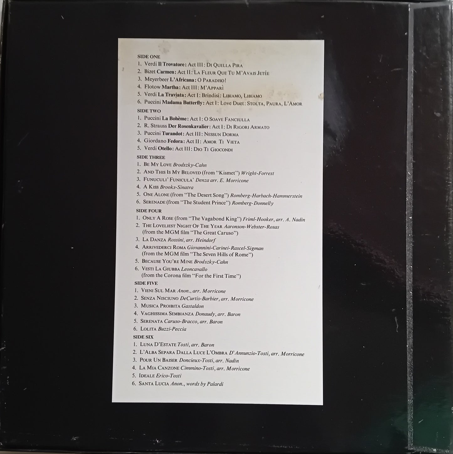 Back cover of a music album with tracklist on a black background