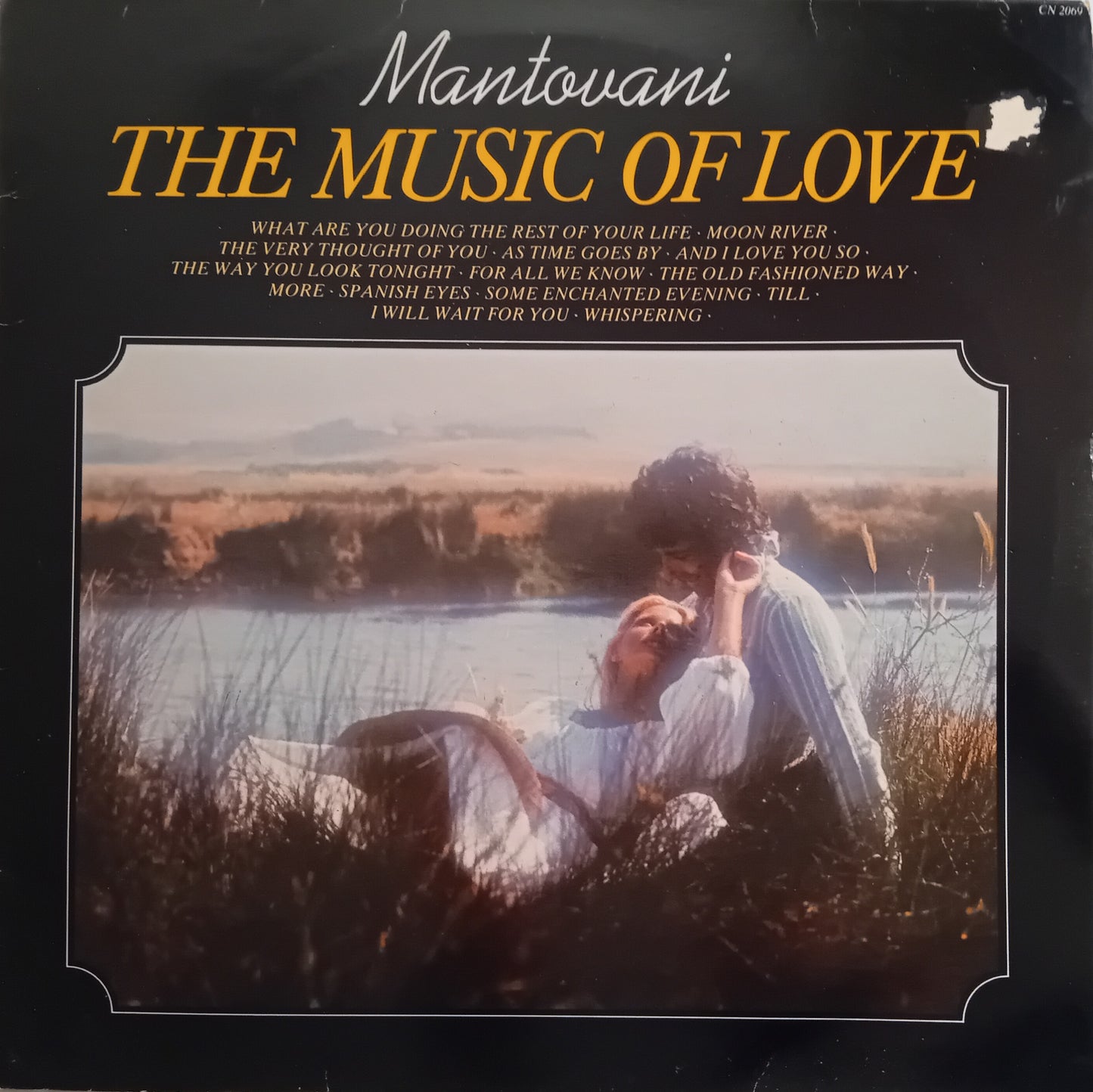 Album cover of 'The Music of Love' by Mantovani with a couple in a field.