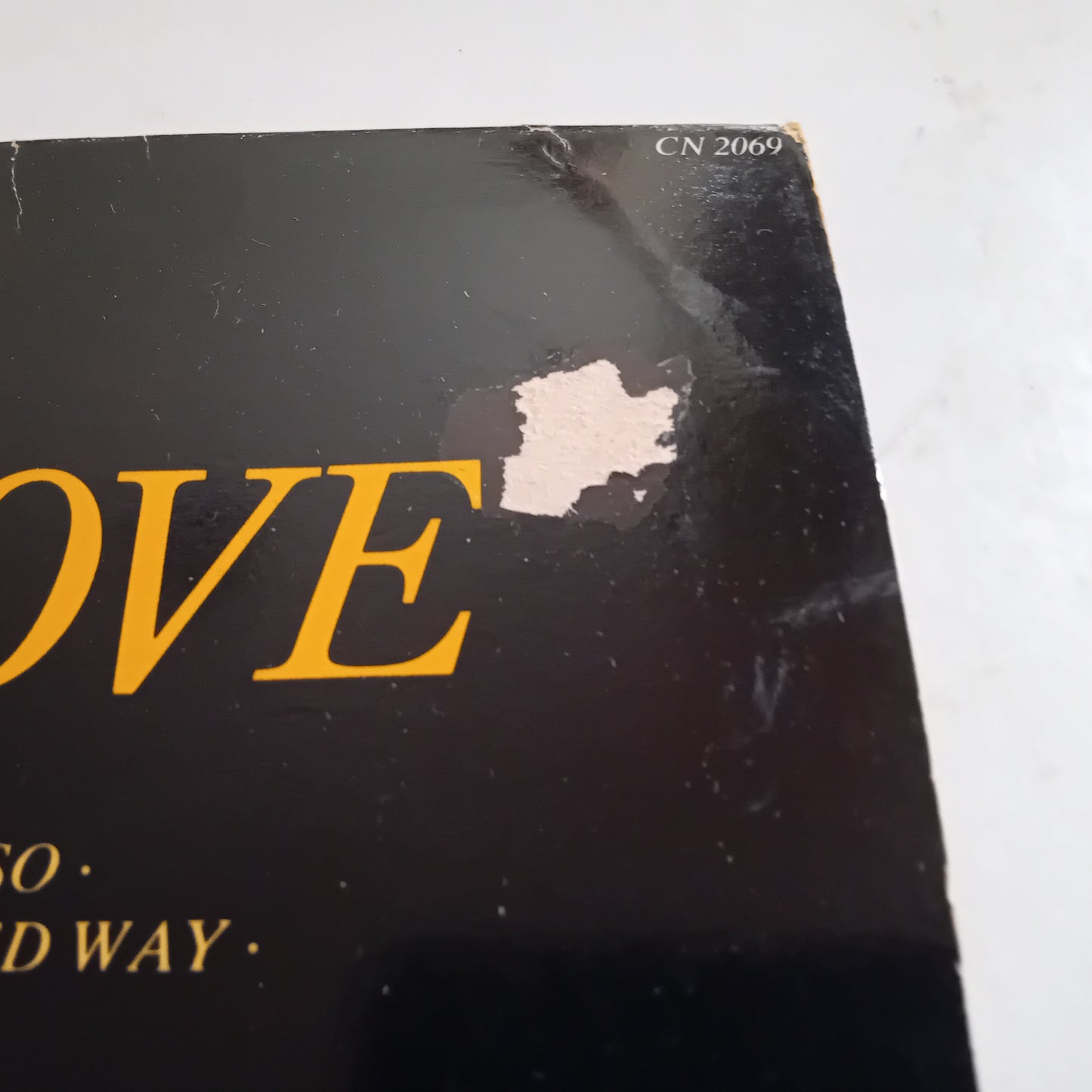 Vinyl record with 'LOVE' text on a white background