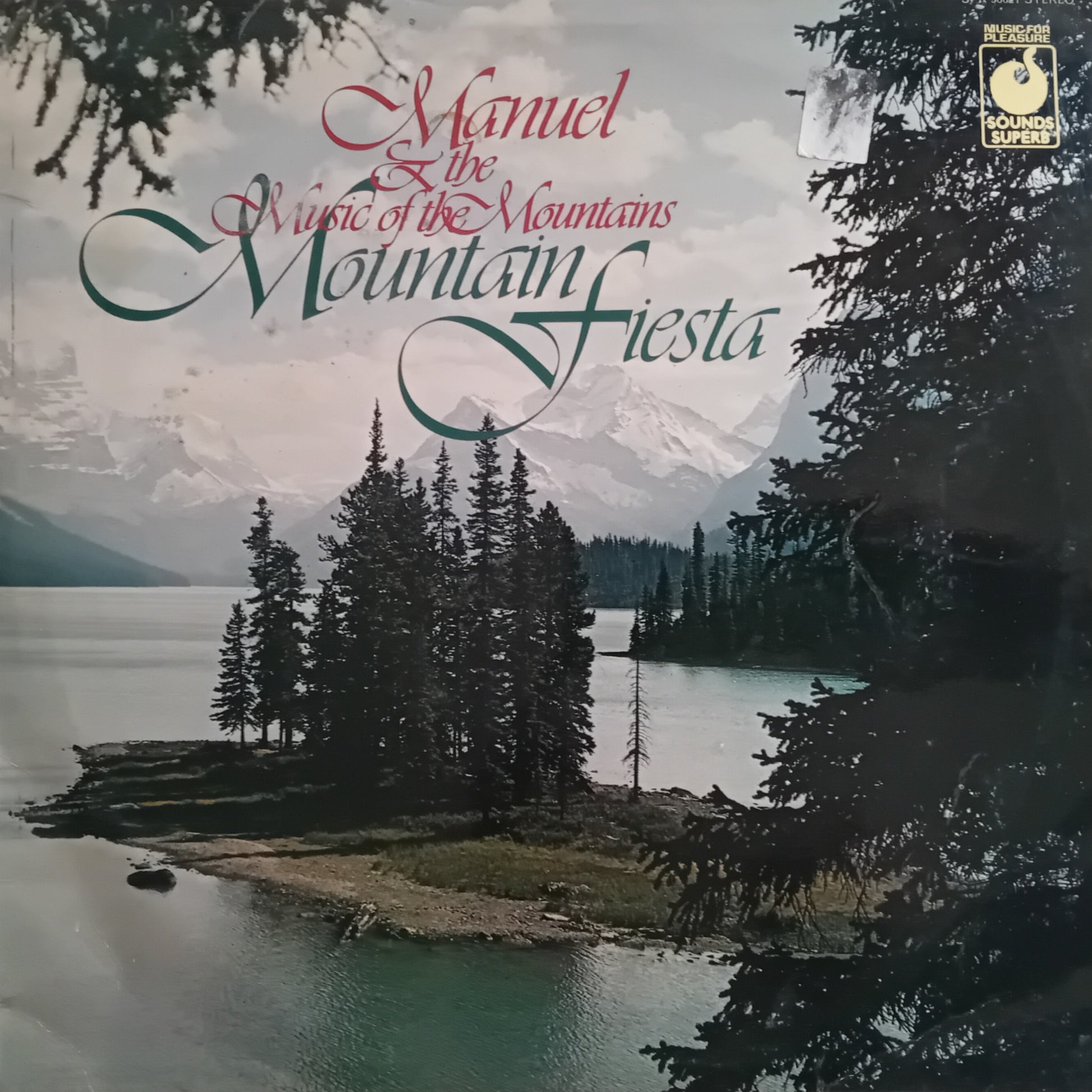 Album cover with mountain and lake scene and text 'Manuel: The Music of the Mountains, Mountain Fiesta'.
