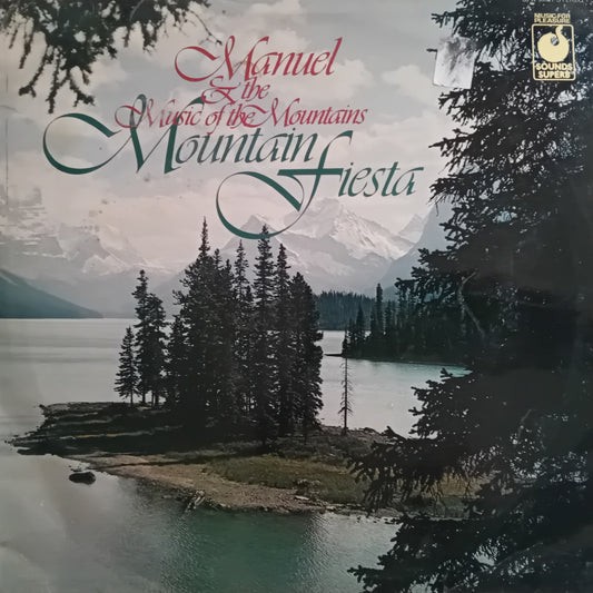 Album cover with mountain and lake scene and text 'Manuel: The Music of the Mountains, Mountain Fiesta'.