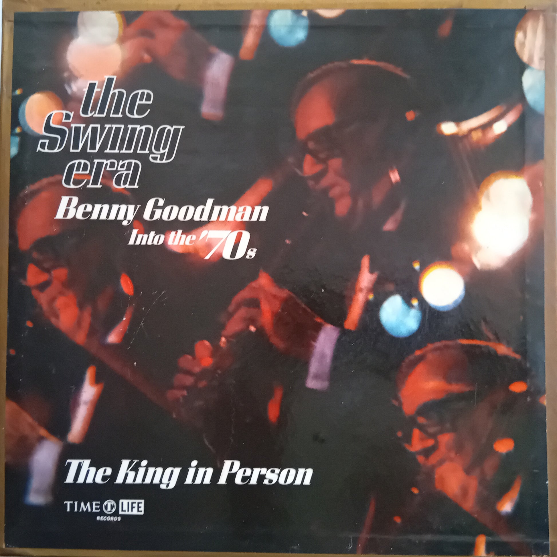 Vinyl record album cover for 'The Swing Era: Benny Goodman Into the 70s' on Time-Life Records, featuring a warm-toned photo of Benny Goodman with other musicians and bright lights.