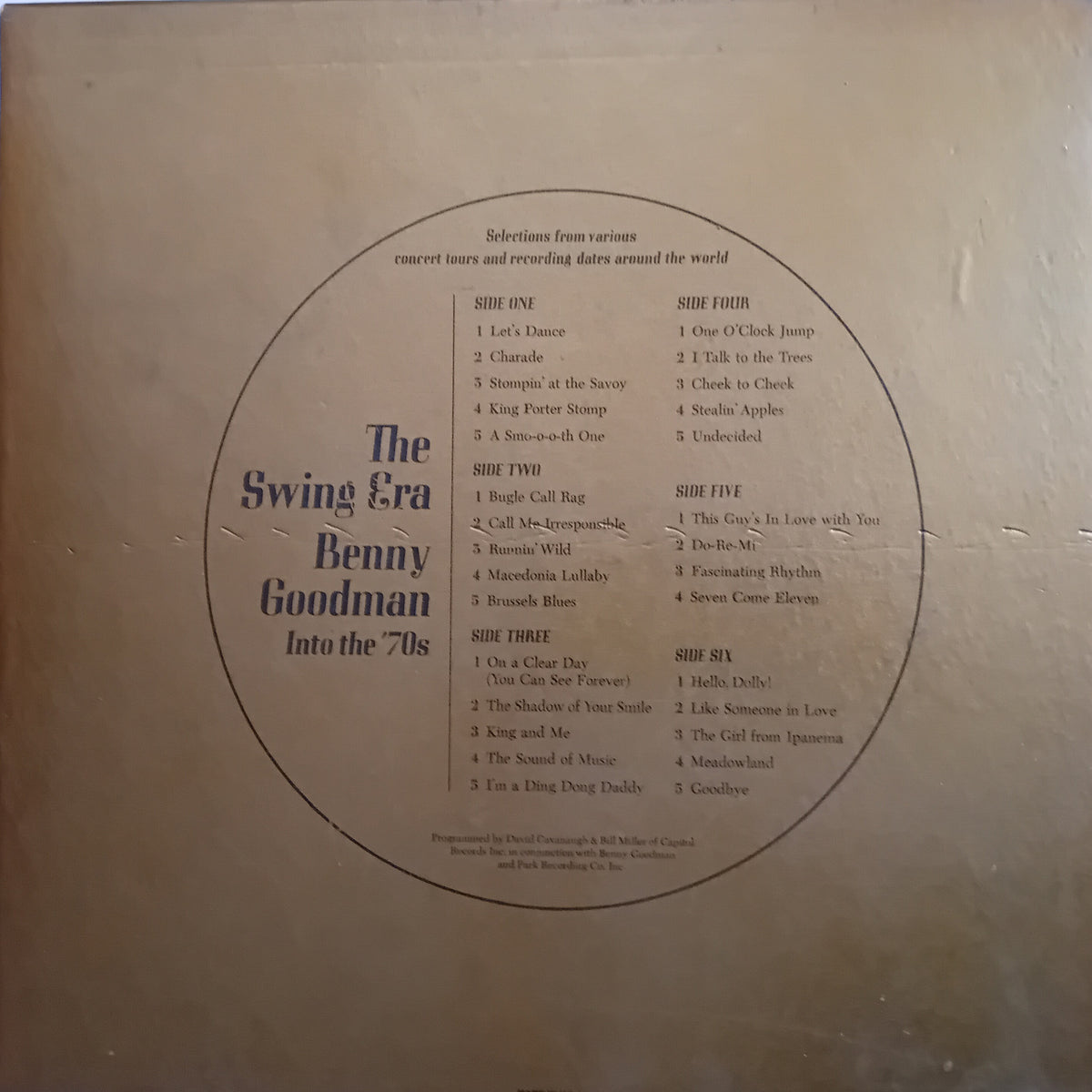 The back cover of a vinyl record for 'The Swing Era Benny Goodman Into the 70s' by Benny Goodman, featuring a printed tracklist inside a large circular border on a beige background.