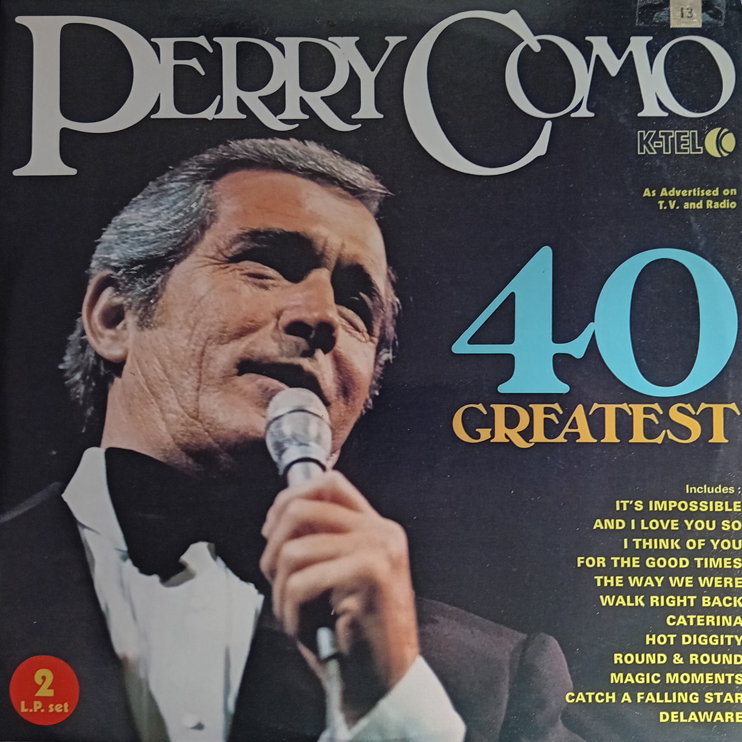 Album cover of Perry Como's '40 Greatest' featuring a portrait of the singer with a microphone.