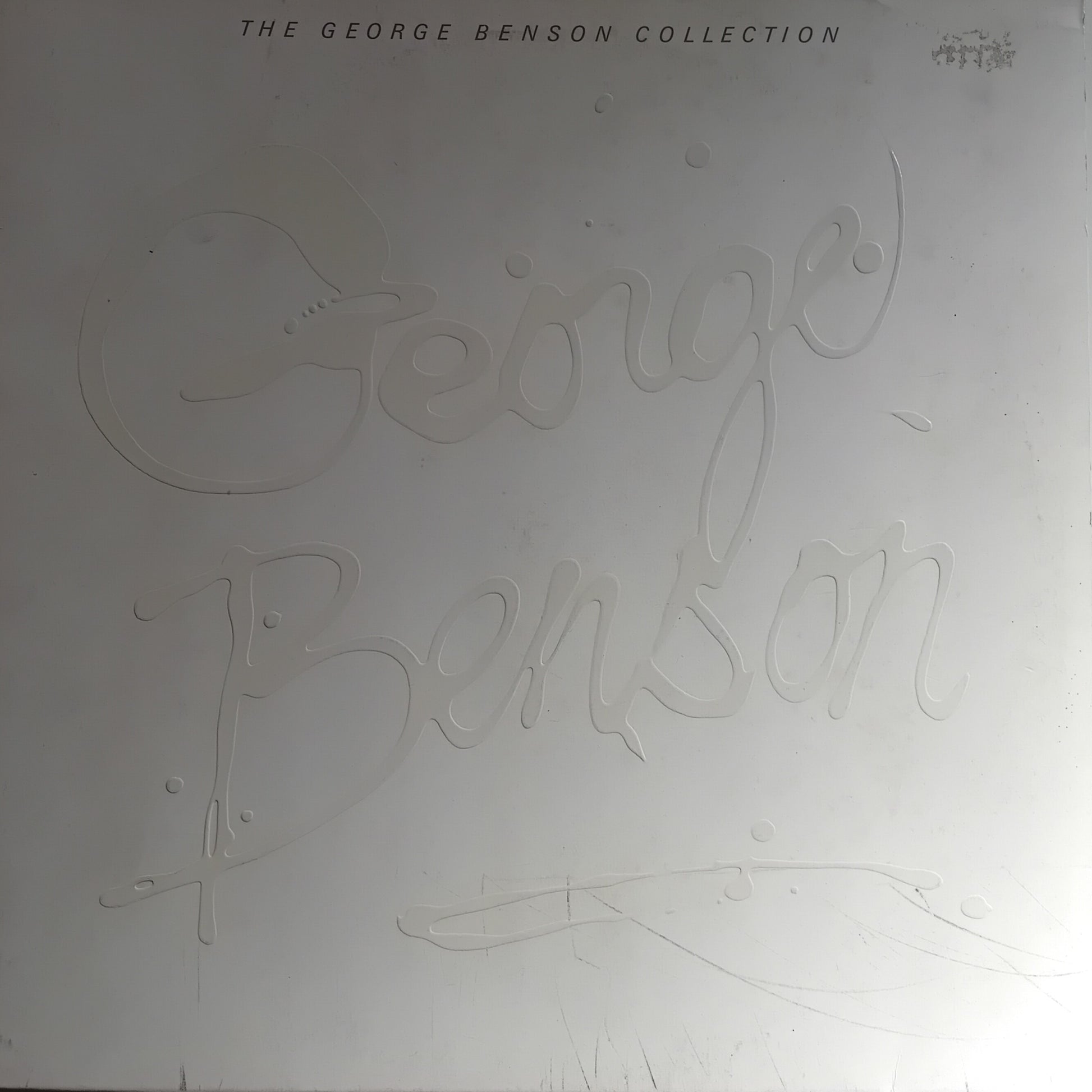 Album cover with 'George Benson' branding on a light gray background