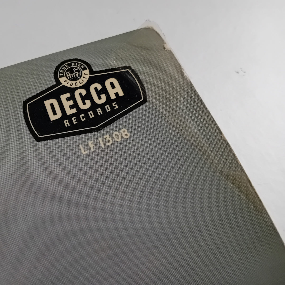 A close-up of a vintage Decca Records LP sleeve, showing the black and cream Decca Records logo and the catalog number LF 1308 on a textured gray cover.