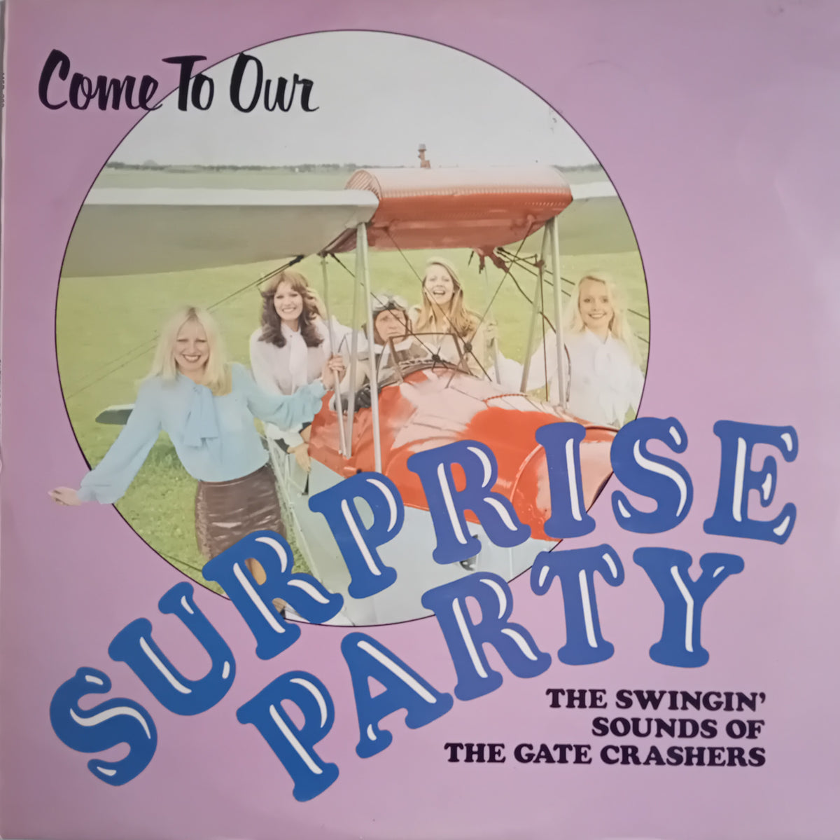 Vinyl record cover for 'Come To Our Surprise Party' featuring a vintage photo of five young women in an airplane on a lavender background with bold blue text.