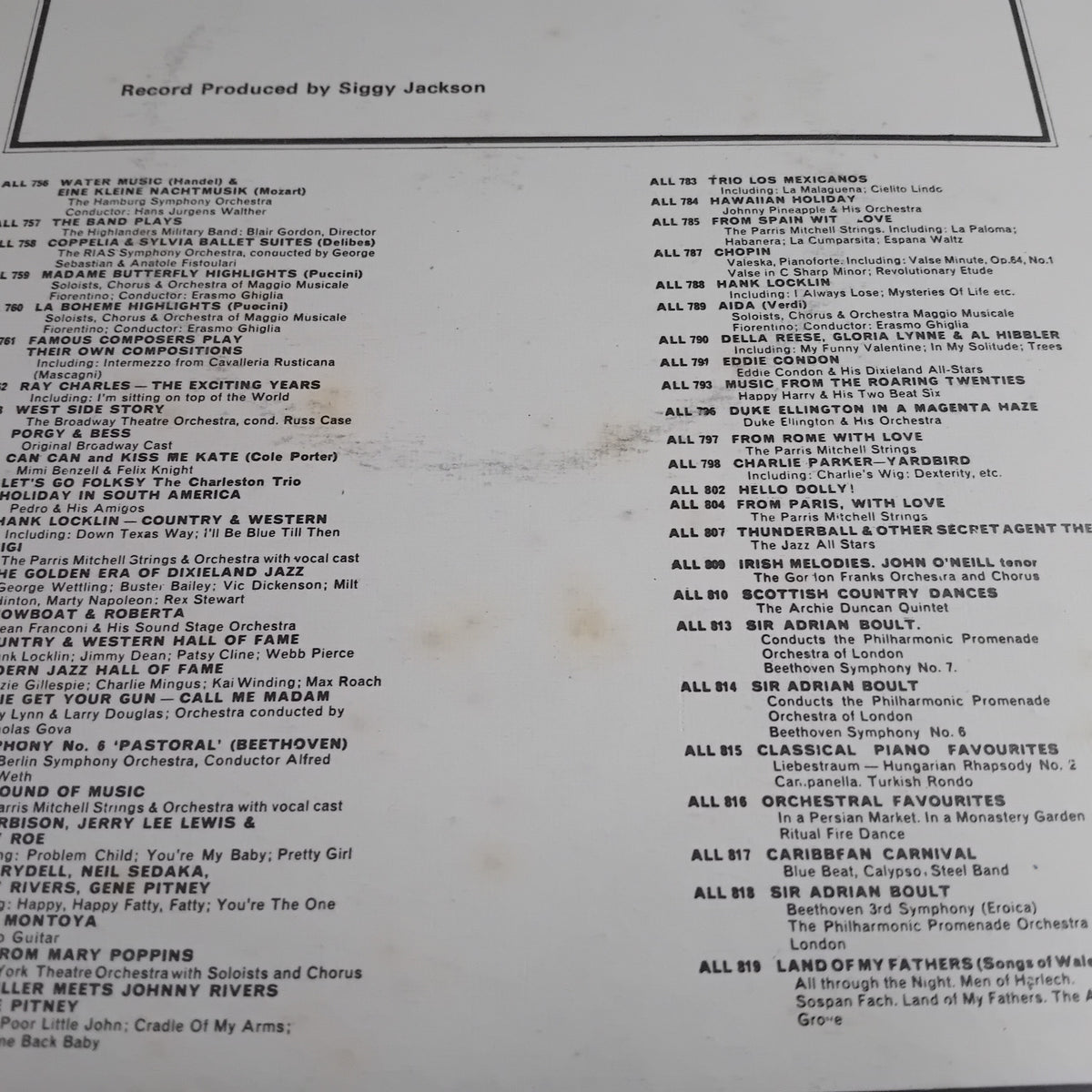 A printed tracklist page titled 'Record Produced by Siggy Jackson' with many song titles and artist names in black text on a white background.