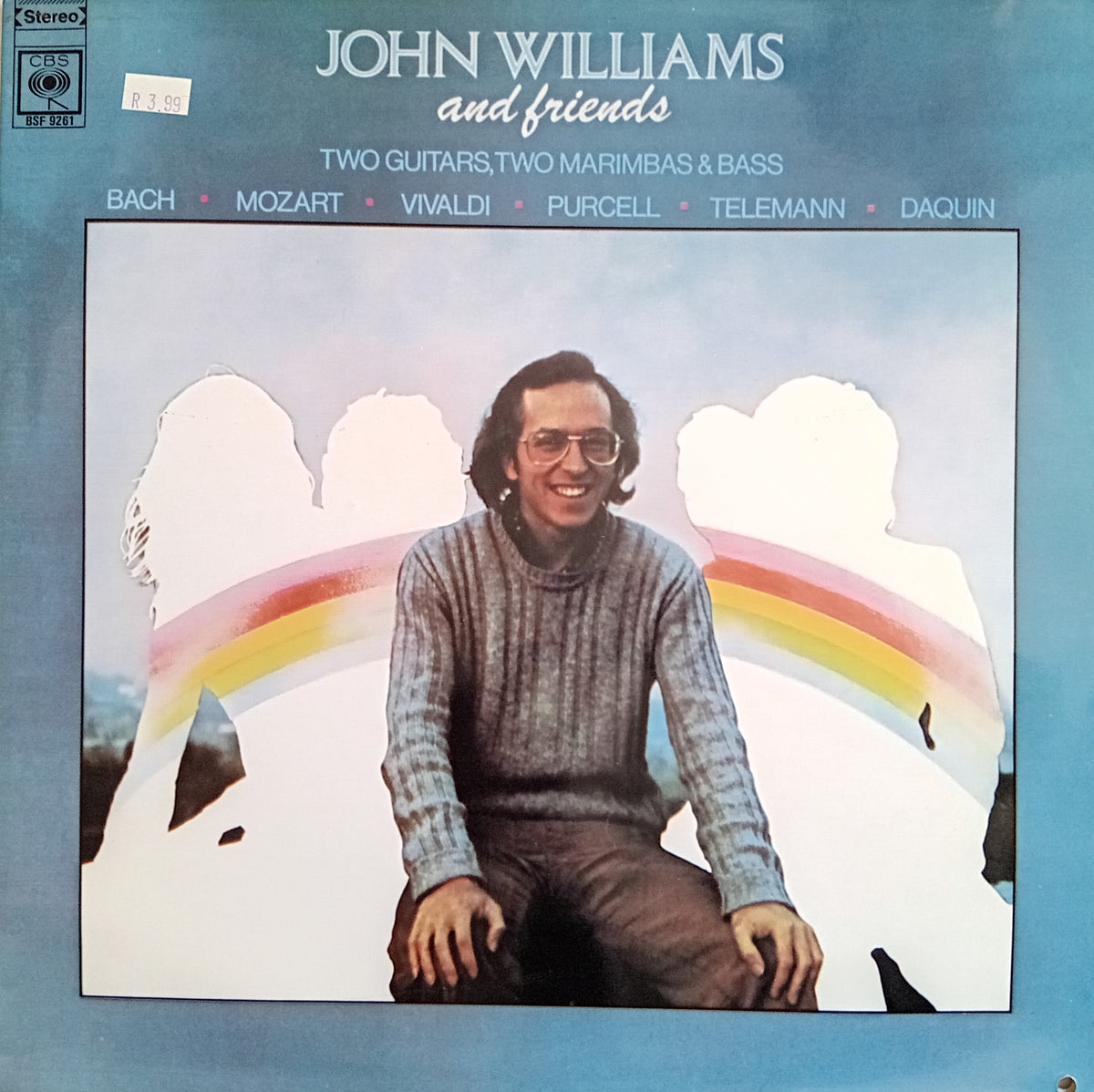 John Williams 'and friends' album cover, featuring a portrait of the artist seated in front of a rainbow on a light blue background. The top text lists the album title and repertoire pieces, and the CBS/Sony logo is visible in the upper left corner.