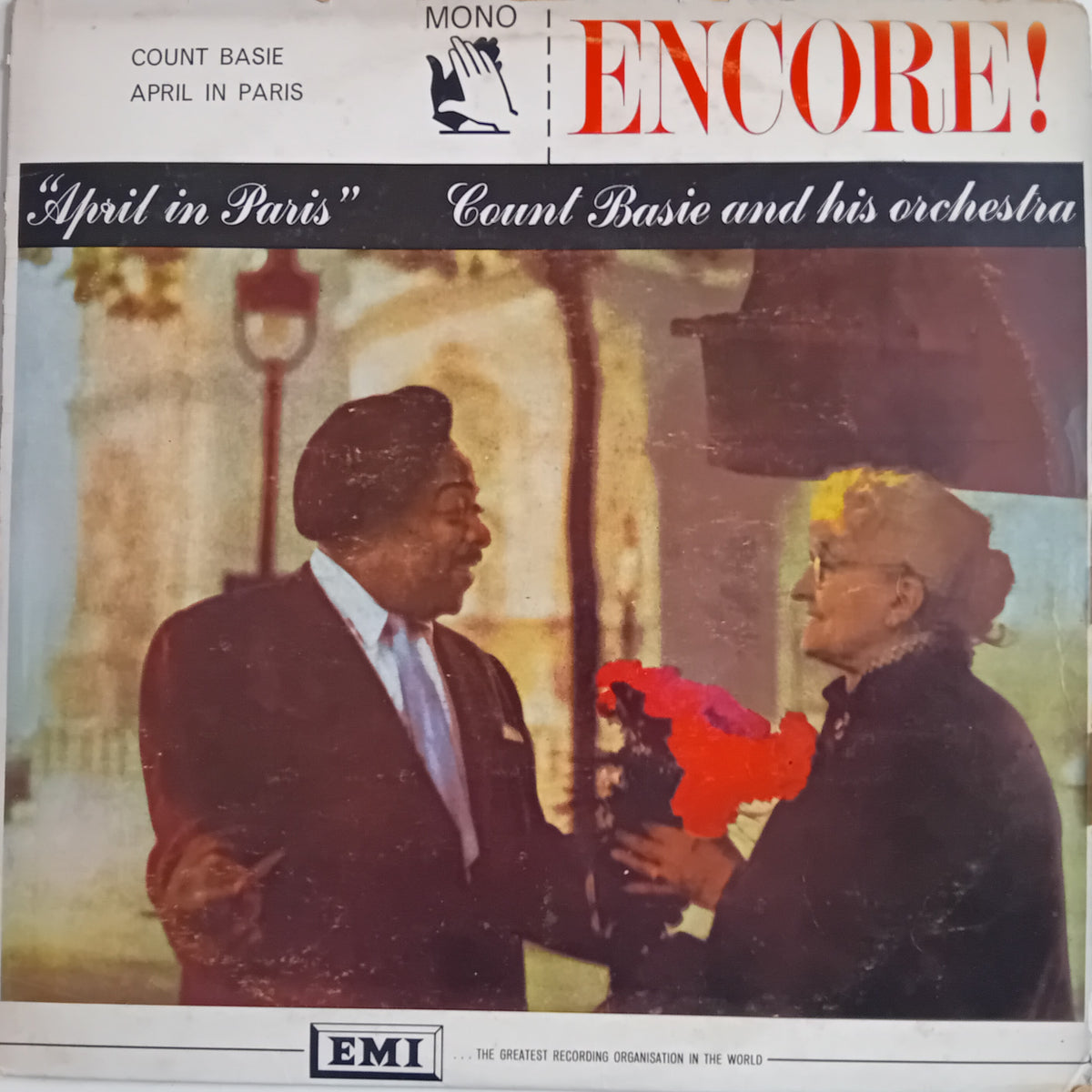 Vintage record sleeve for Count Basie's 'April in Paris' on EMI Records, featuring a photo of Count Basie and a woman with a red flower bouquet, with bold red 'ENCORE!' text at the top.