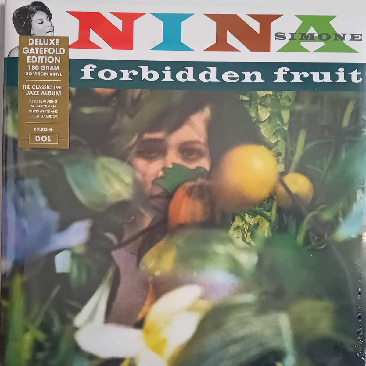Nina Simone 'Forbidden Fruit' gatefold vinyl album cover, featuring a vintage photograph of the artist surrounded by tomatoes and green leaves, with a gold gatefold sticker on the left.
