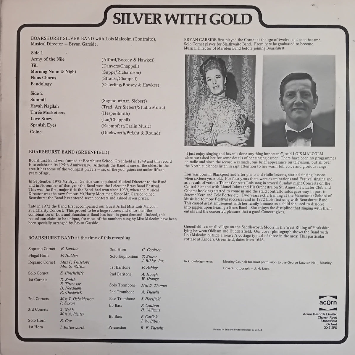 The back cover of a vinyl record for  'Silver With Gold' featuring the Boarhust Band, published by Acorn Records. The cover is printed in black ink on a light beige background and includes track listings, credits, and two black-and-white photographs of Bryan Gardner.