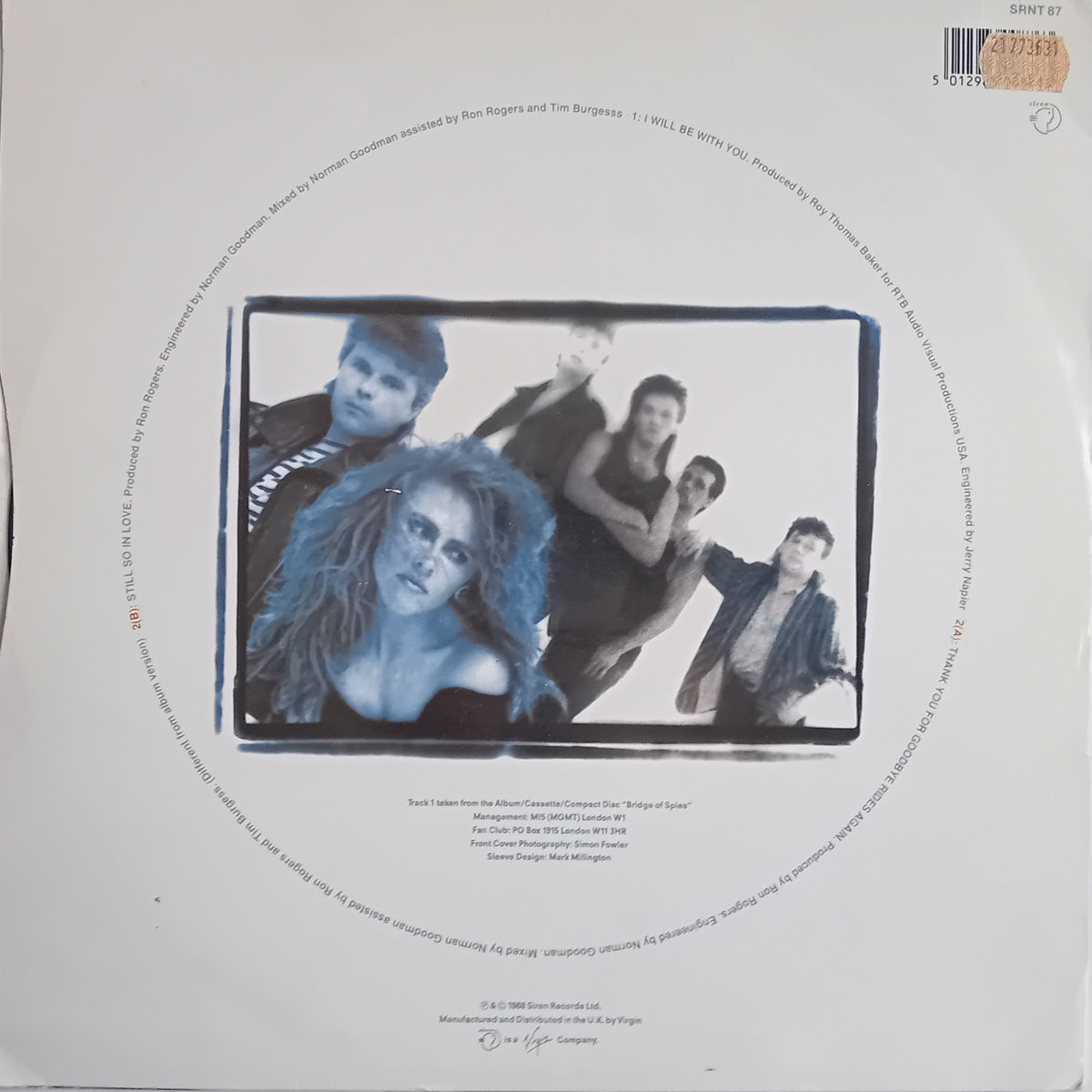 The back cover of a T'Pau vinyl record sleeve showing a black-and-white group photo of the band members, track listing text, and barcode.