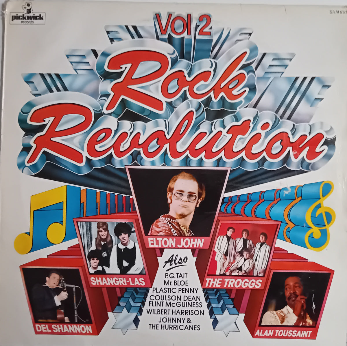 Vinyl record album cover for 'Rock Revolution Vol 2' featuring a retro 1970s design with large red and white title text, blue graphic elements, and photos of rock bands including Elton John, Shangri-Las, The Troggs, Del Shannon, Plastic Penny, Colleen Dean, Fun World, Wilbert Harrison, Johnny & The Hurricanes, and Alan Toussaint.