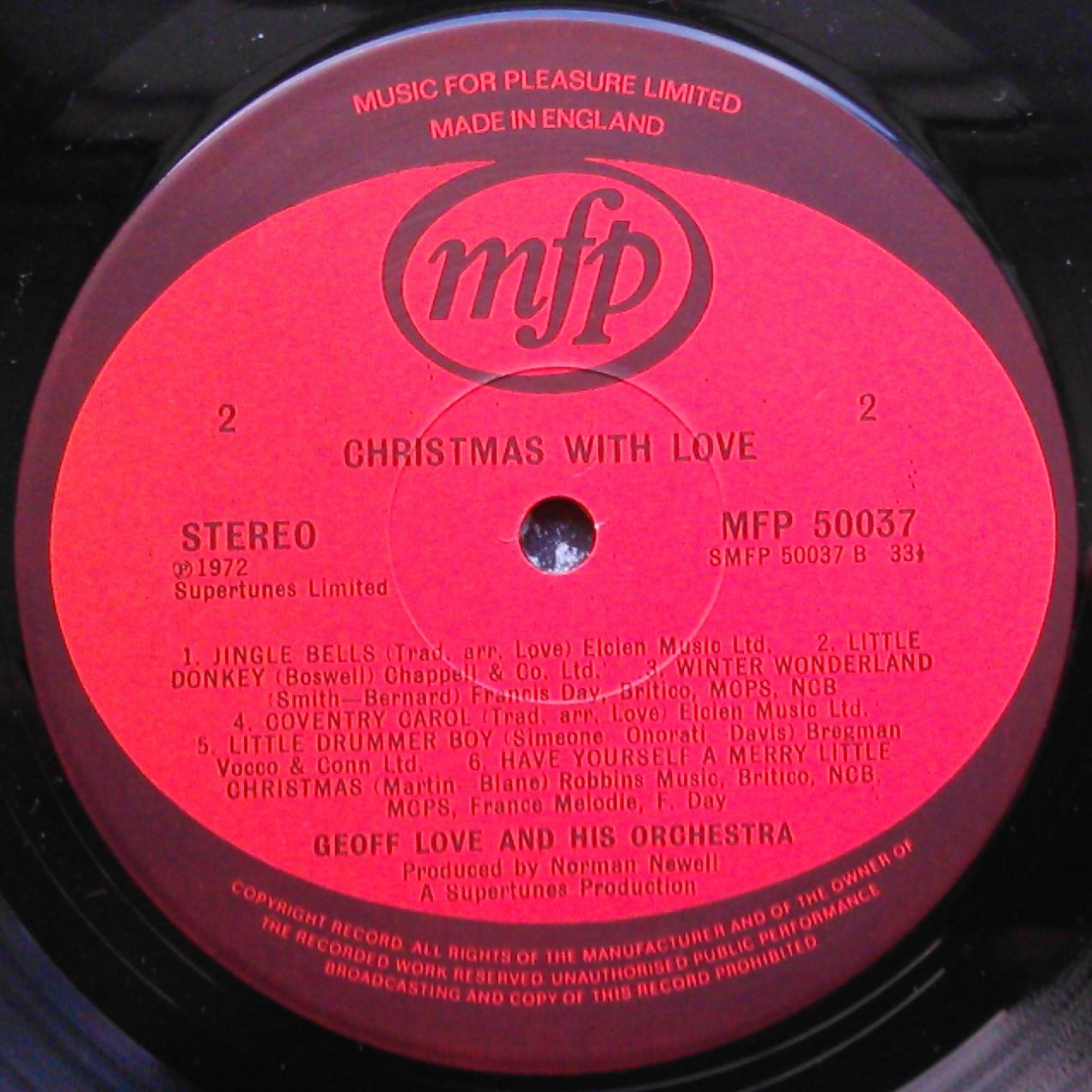 Record label with 'mfp' logo and text on a red background