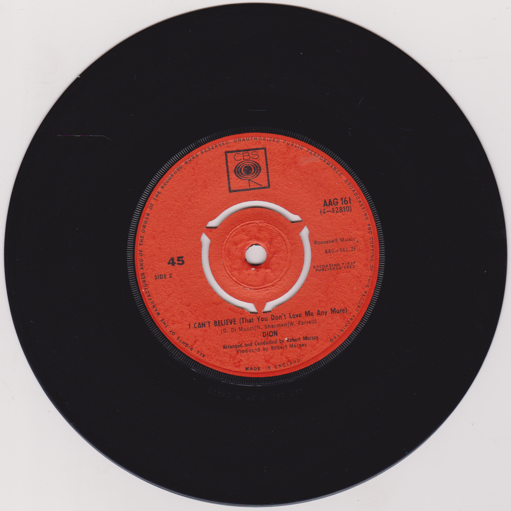Vinyl record with a red label on a white background