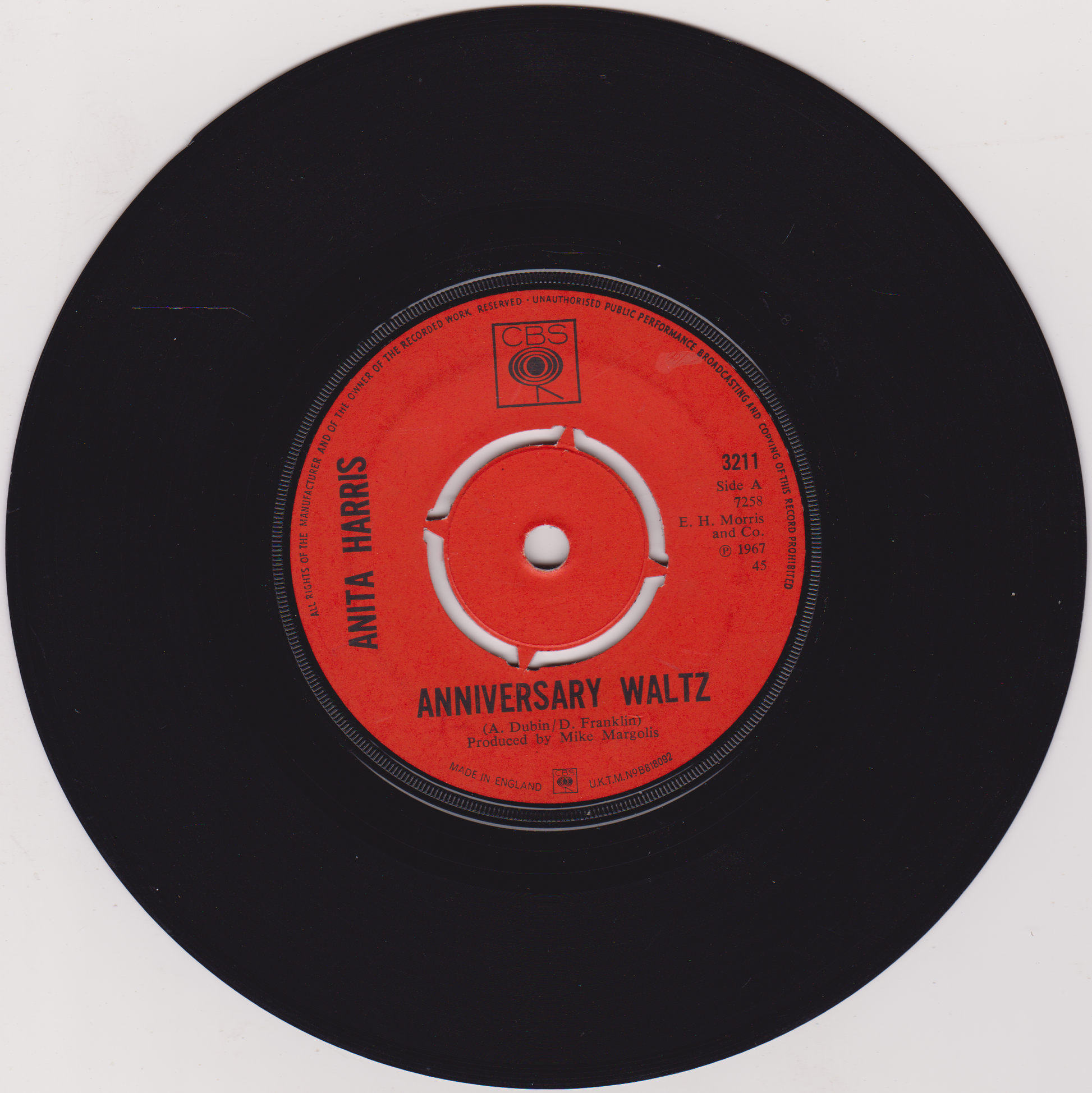 Vinyl record with a red label featuring 'Anita Harris' and 'Anniversary Waltz'.