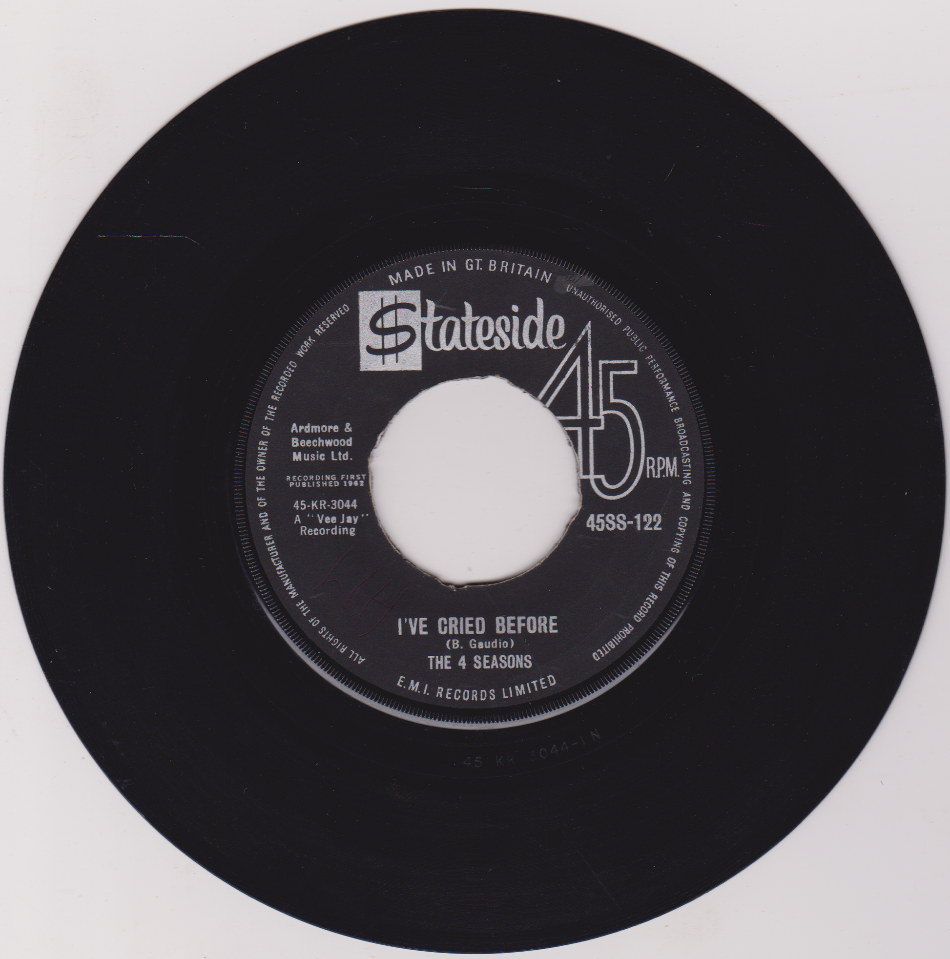 Black vinyl record with a clear center on a white background