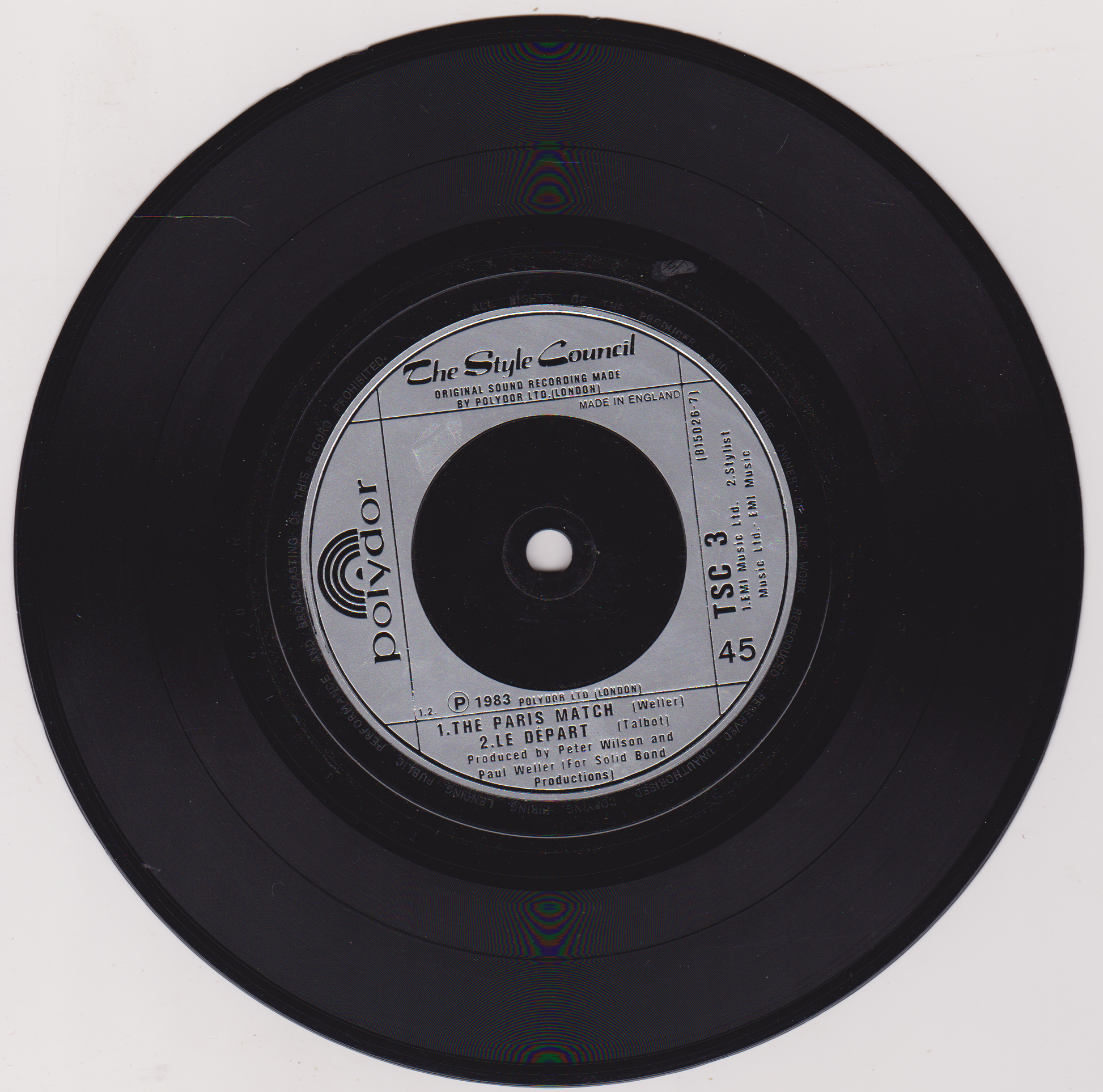 Black vinyl record with label on a white background