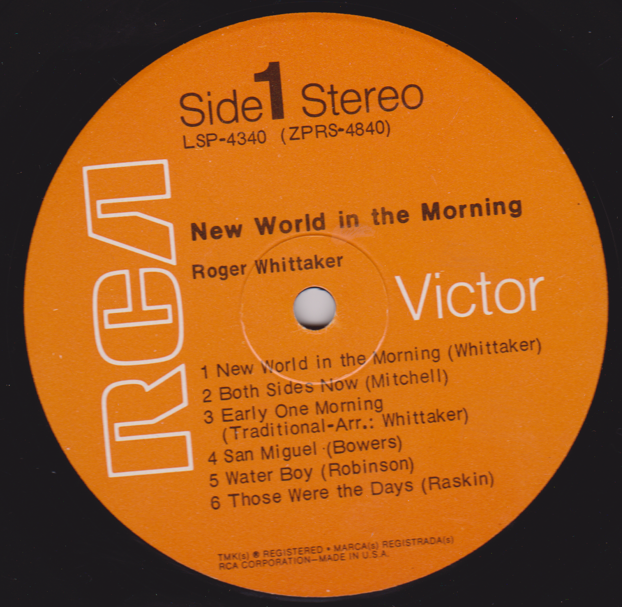 Orange vinyl record label with text and track listing on a black background