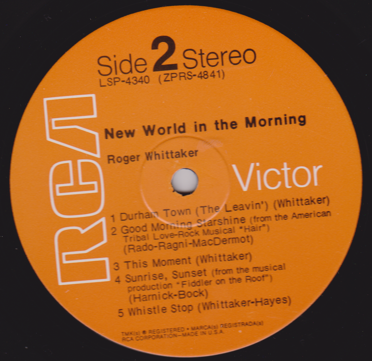 Record label for Side 2 of a stereo album by Roger Whittaker with track listing on an orange background.