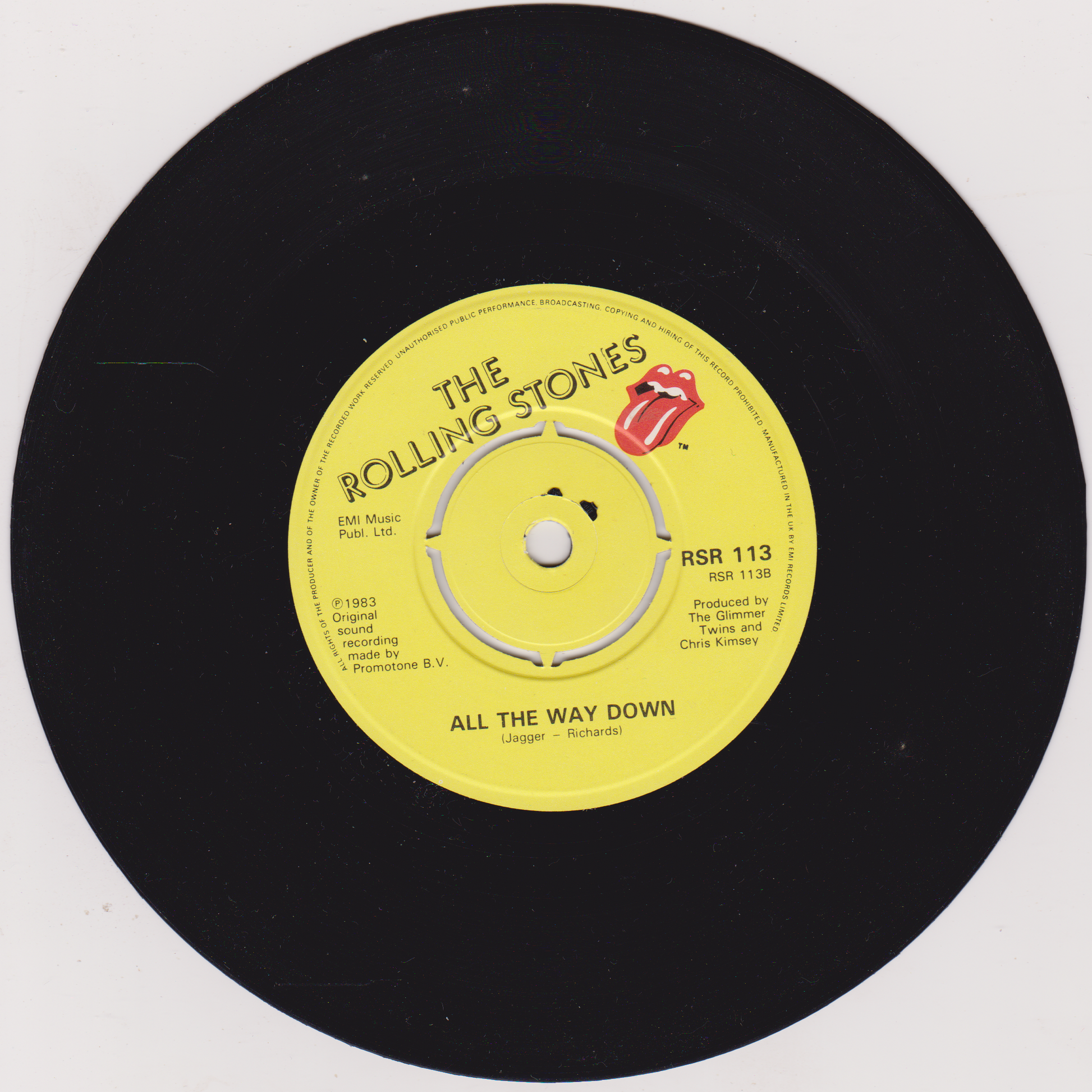 Vinyl record with yellow label featuring The Rolling Stones logo and text.