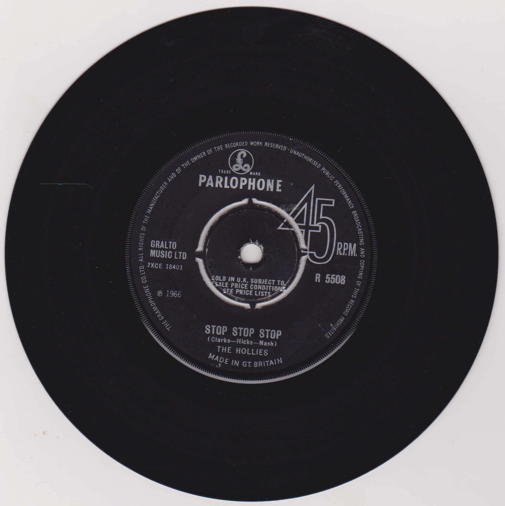 Black vinyl record with Parlophone label on a white background