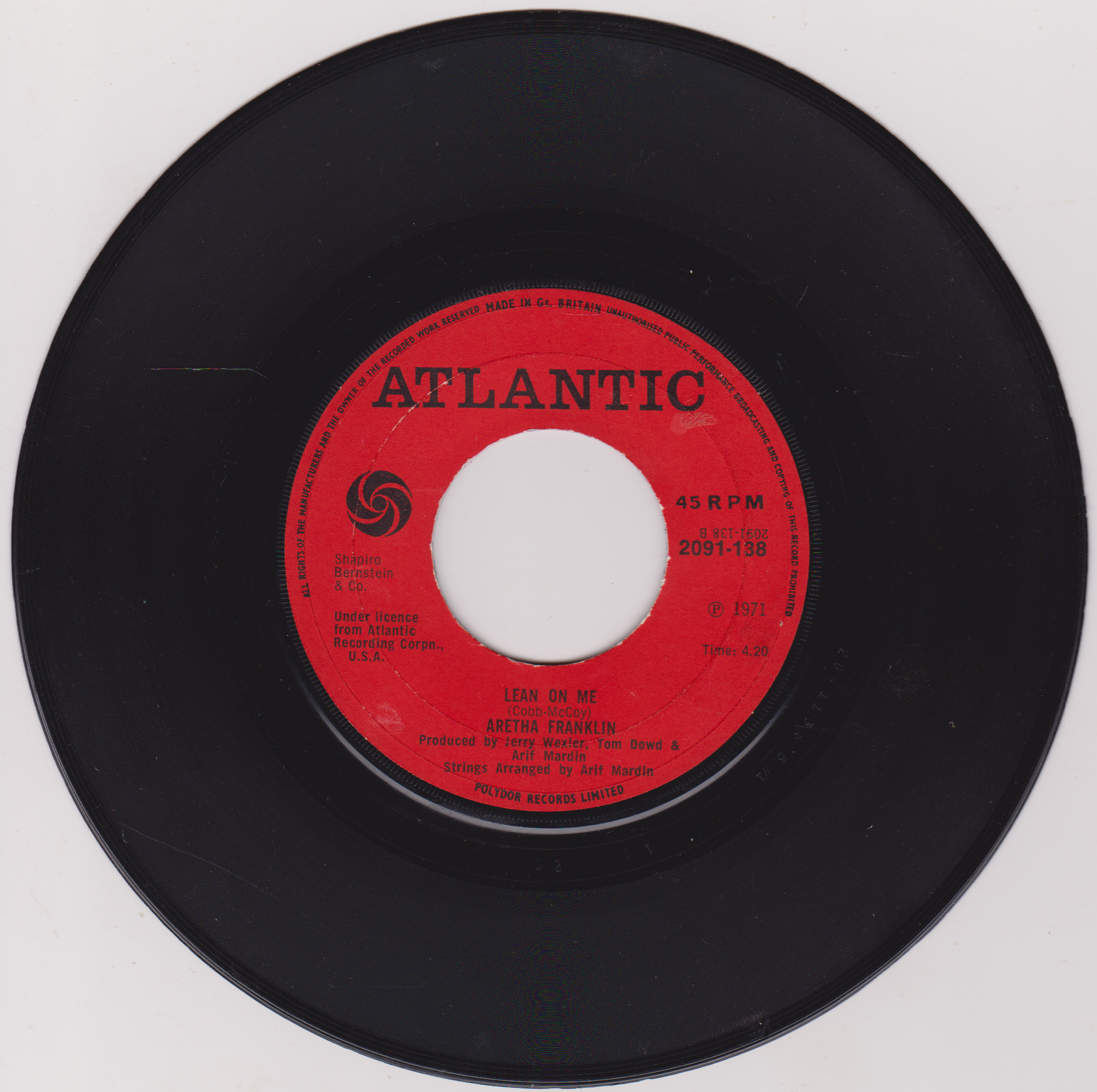 Black vinyl record with a red label featuring the Atlantic Records logo on a white background