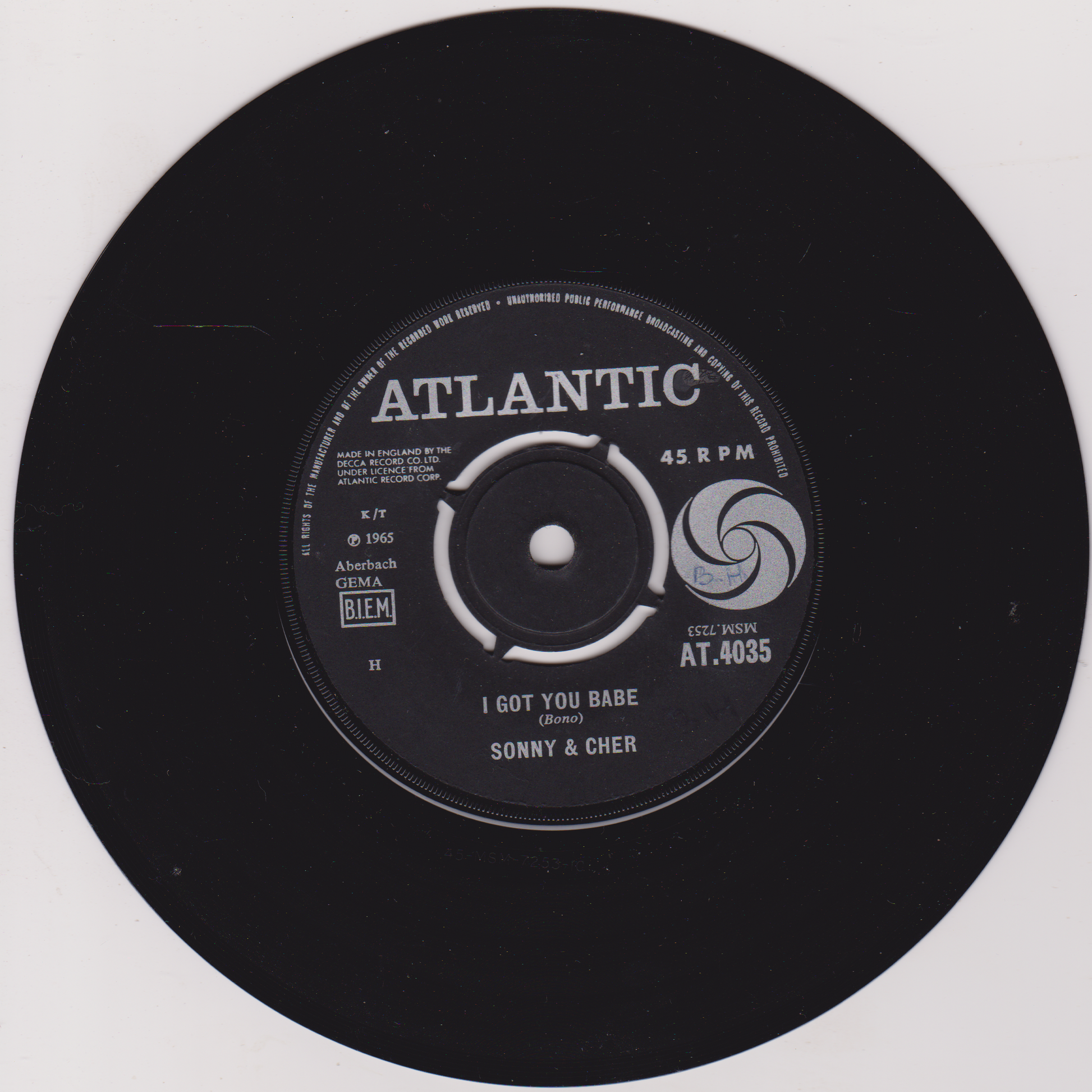 Black vinyl record with Atlantic label and Sonny & Cher's 'I Got You Babe' on a white background
