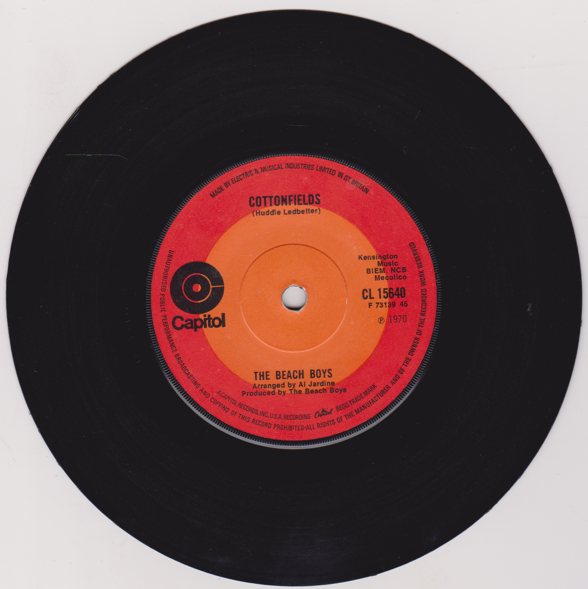 Vinyl record with orange label featuring 'The Beach Boys' on a white background