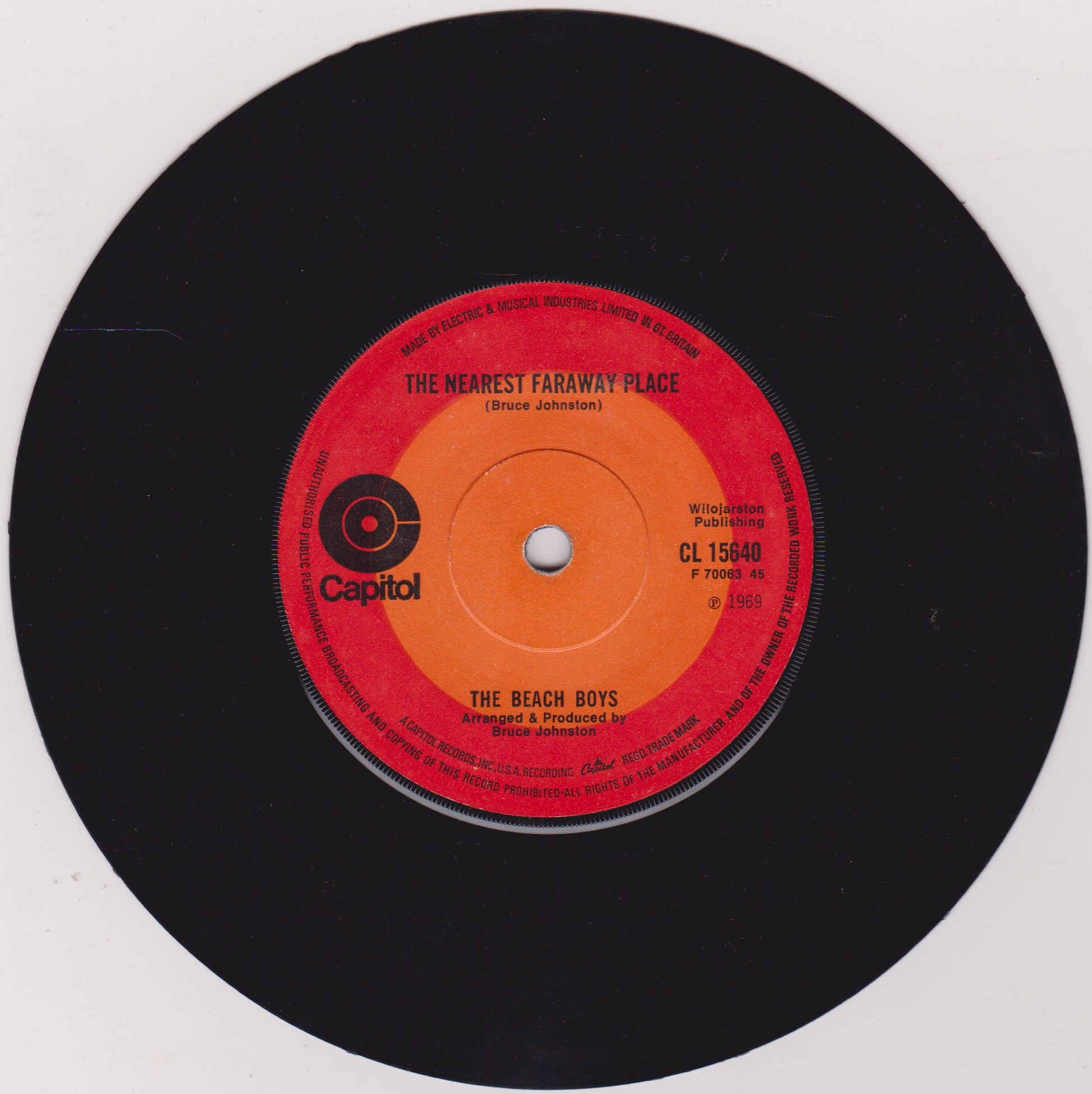 Vinyl record with red label featuring 'The Beach Boys' on a white background