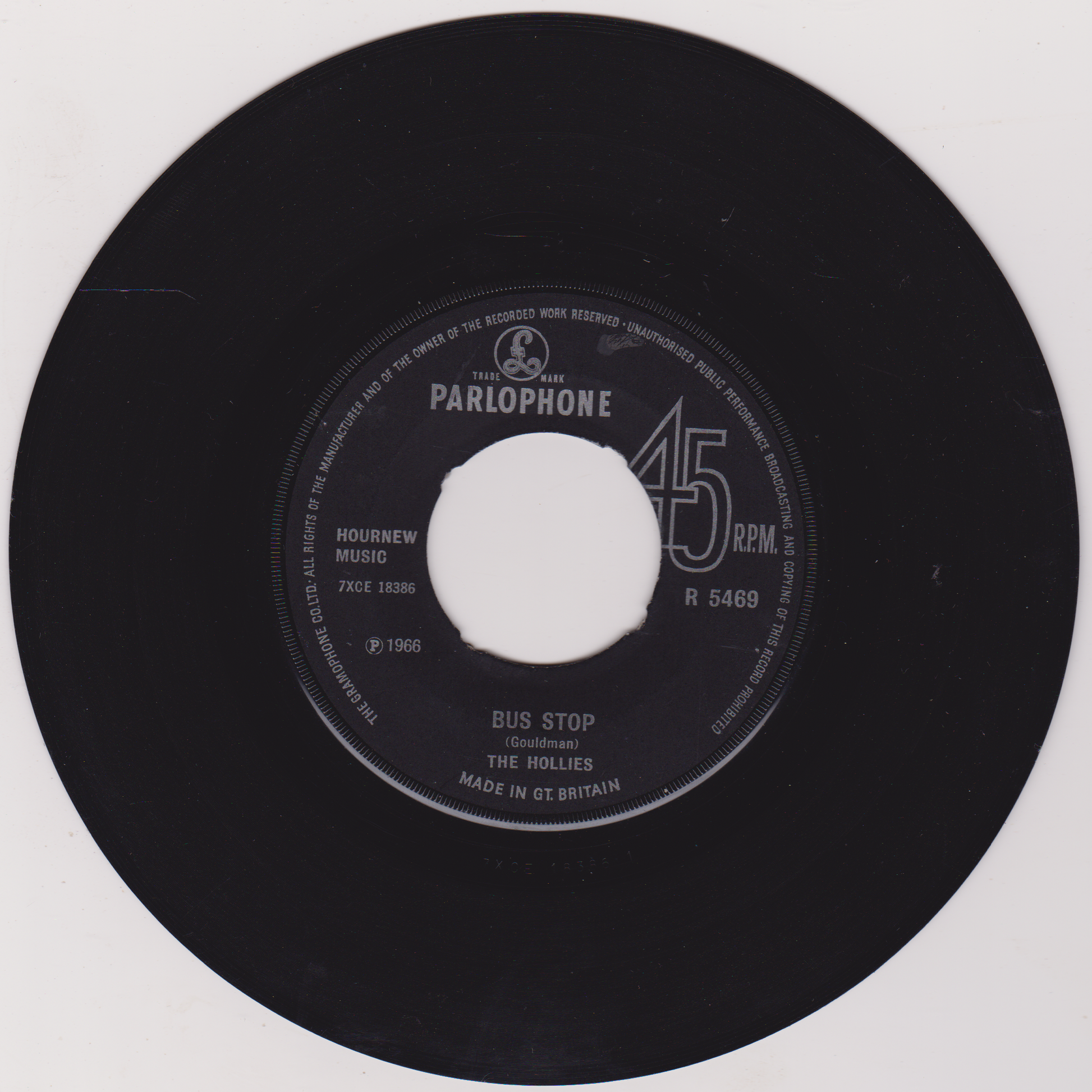 Black vinyl record with Parlophone label on a white background