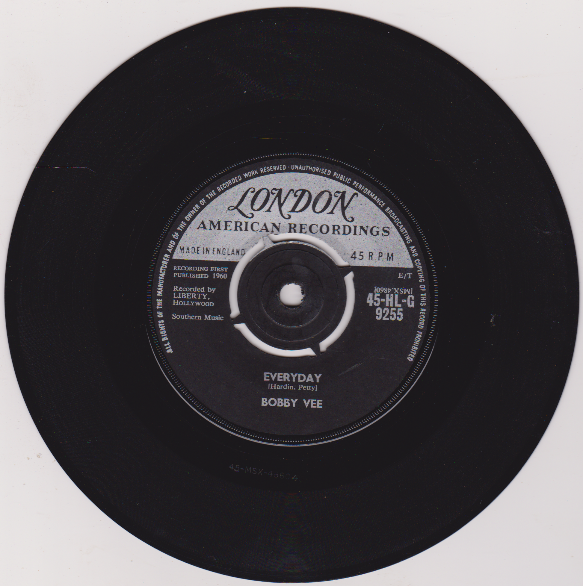 Black vinyl record with 'London American Recordings' label on a white background