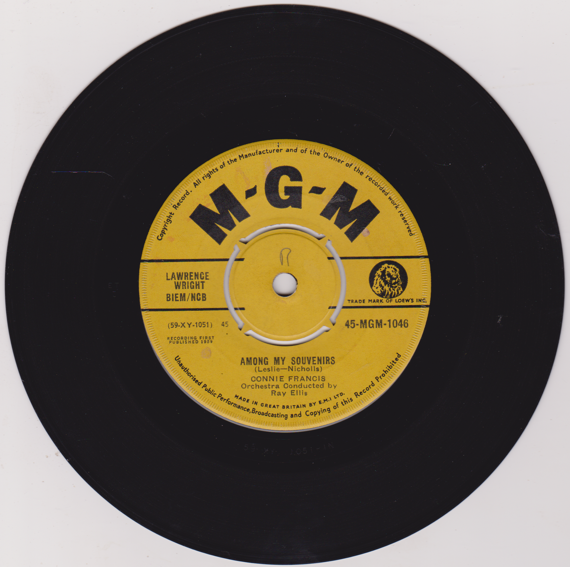 Vintage black vinyl record with yellow label featuring MGM logo