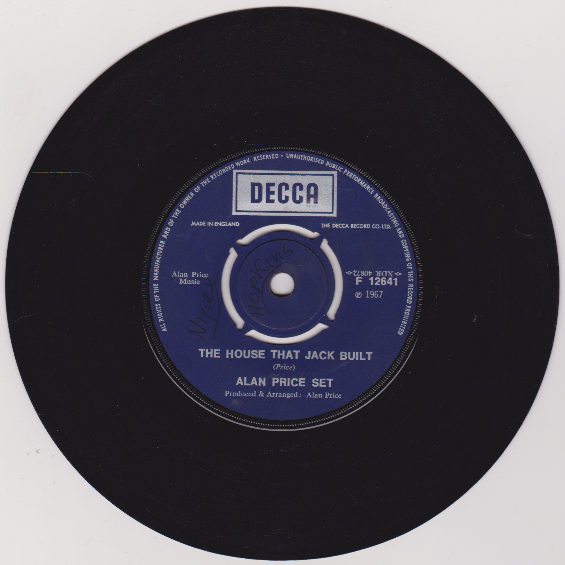 Vinyl record with a blue label featuring 'Decca' and song details on a white background