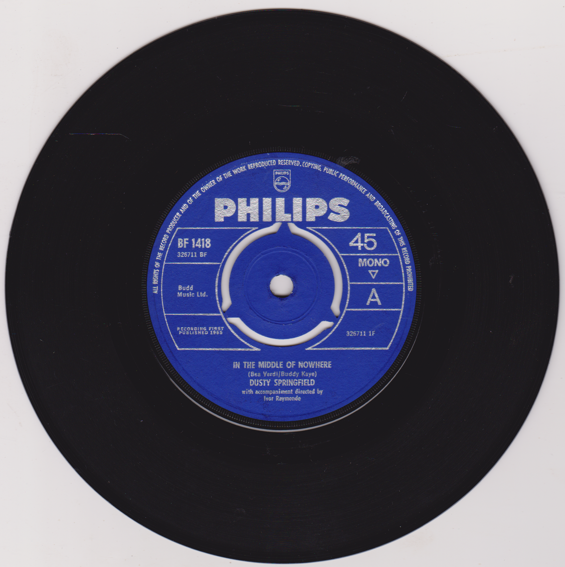 Black vinyl record with a blue Philips label on a white background