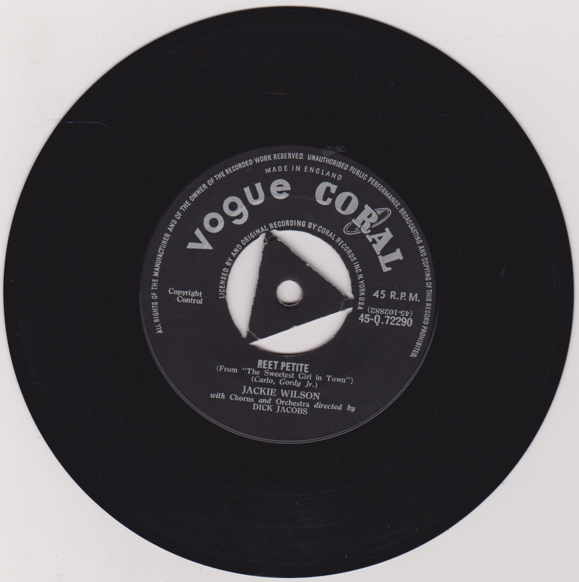Black vinyl record with 'Vogue Coral' label on a white background