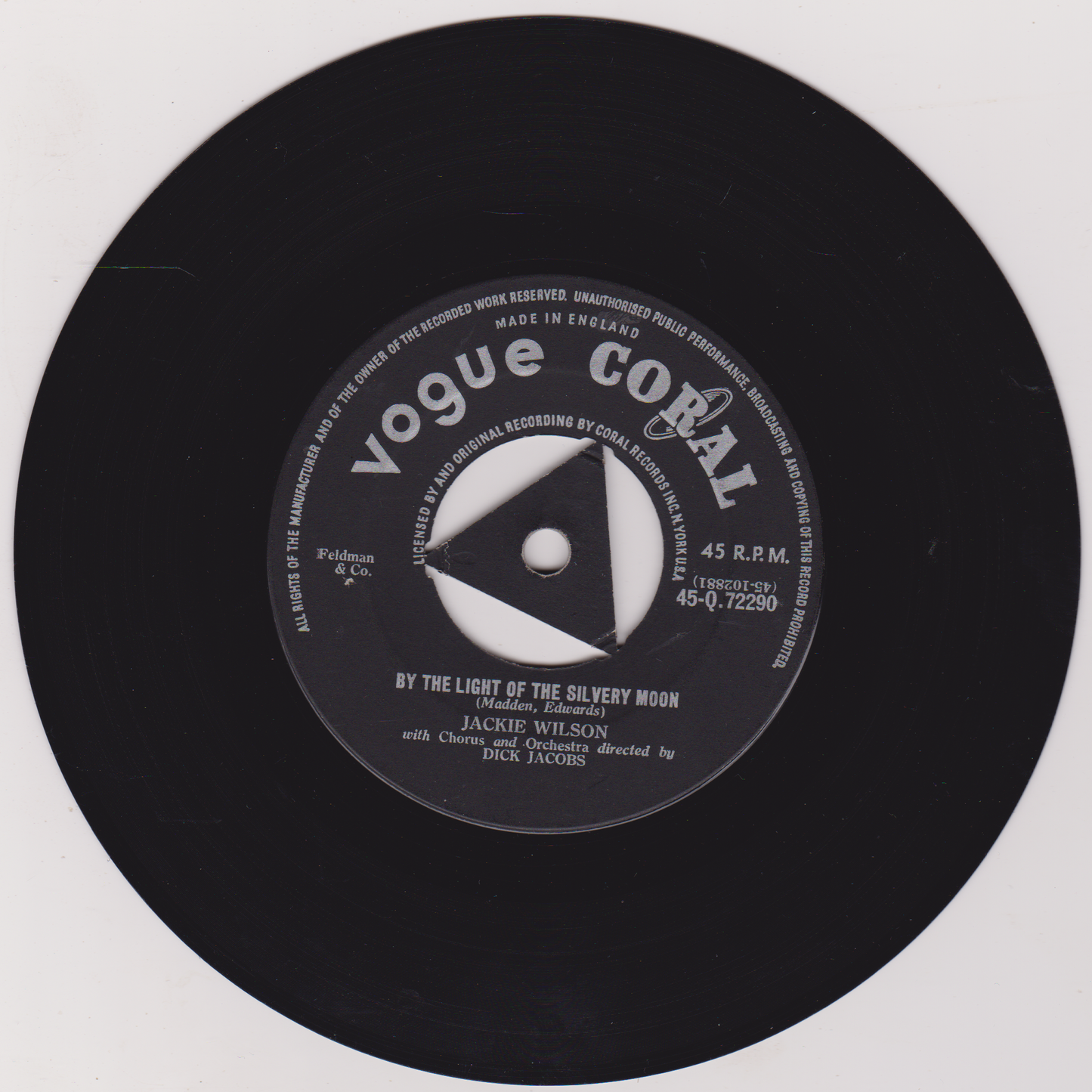 Black vinyl record with a label on a white background