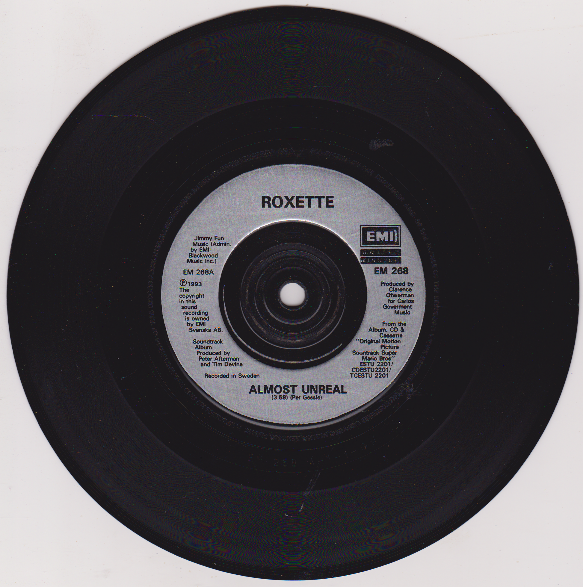 Vinyl record with Roxette 'Almost Unreal' on a white background