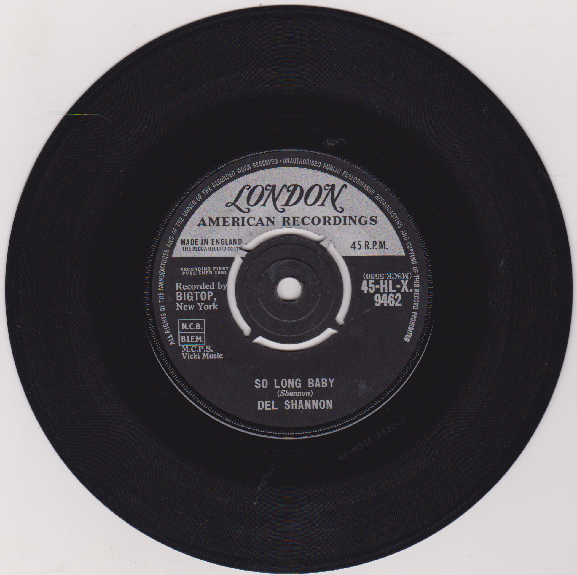 Black vinyl record with 'London American Recordings' label on a white background