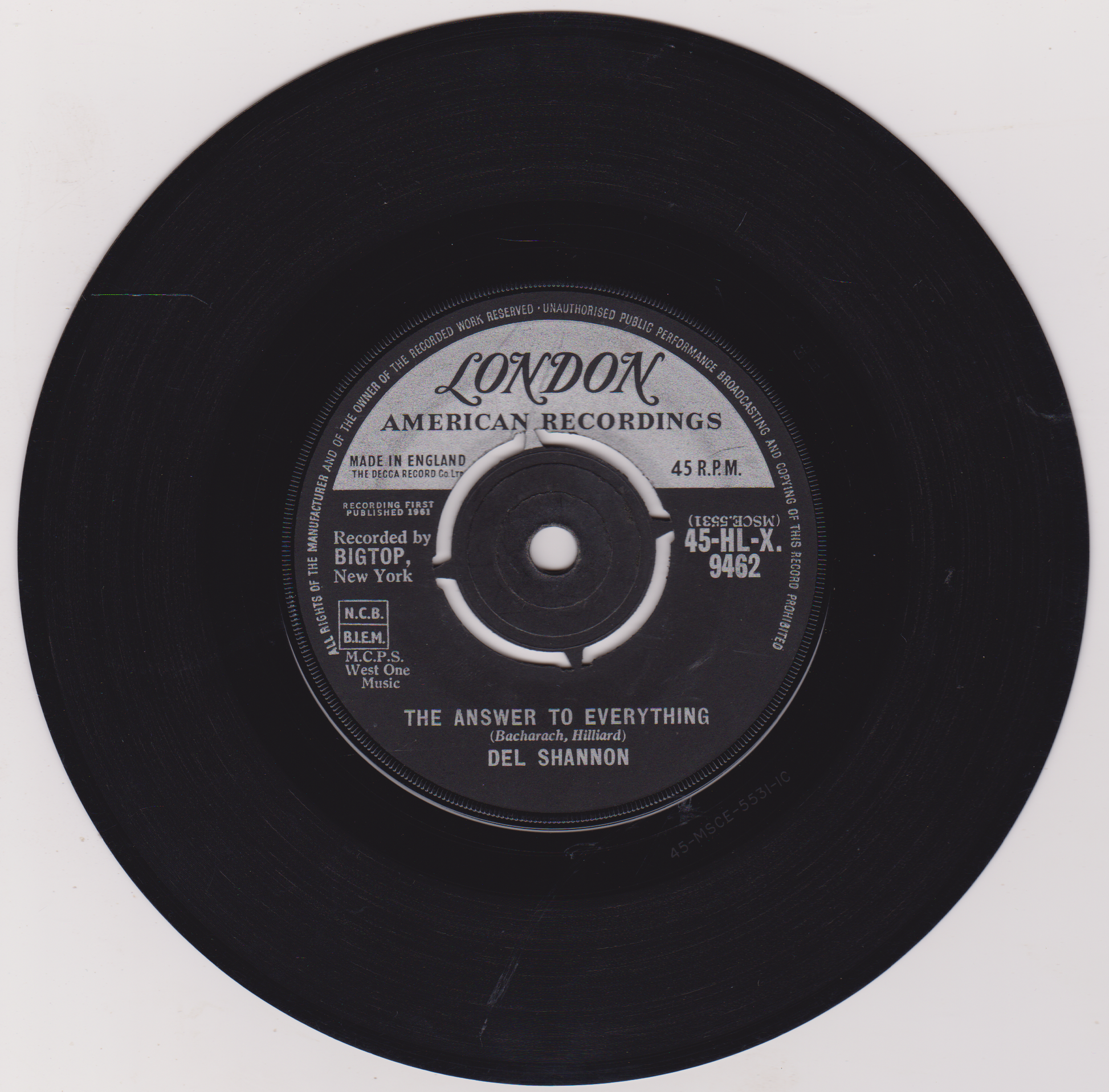 Black vinyl record with 'London American Recordings' label on a white background