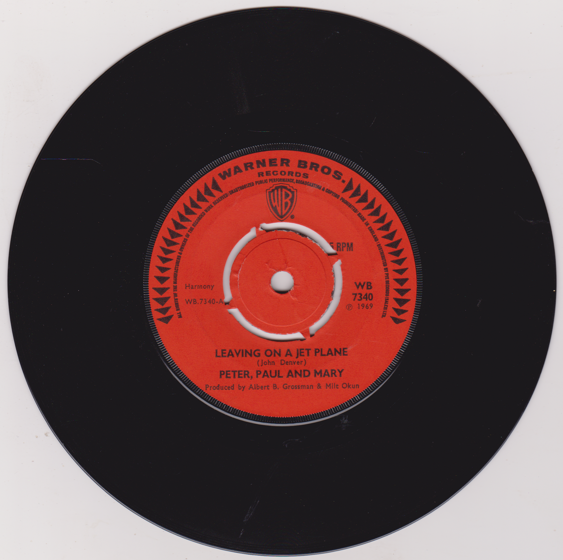 Vinyl record with red label featuring 'Warner Bros. Records' logo and text.