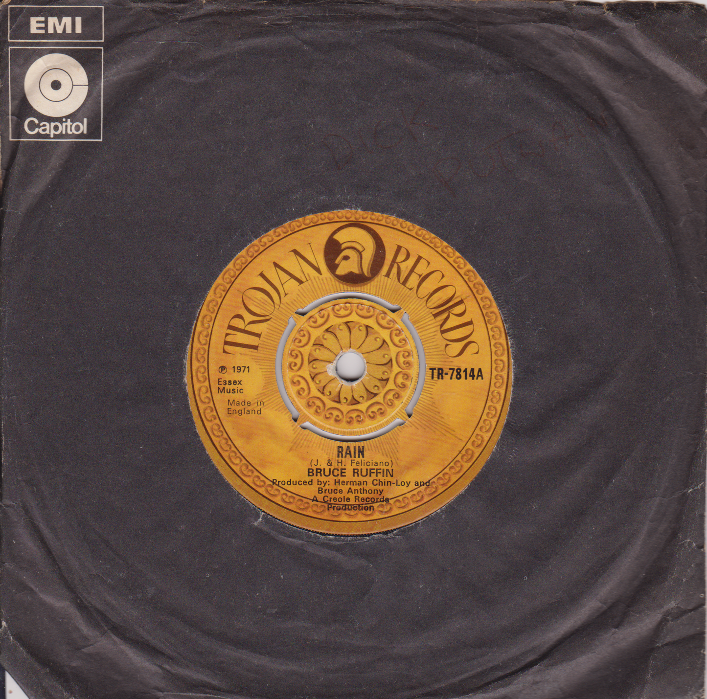 Record label with Trojan Records logo and EMI Capitol branding on a dark background
